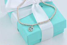 Load image into Gallery viewer, Tiffany &amp; Co. Silver Peace Charm Mini Beaded Bracelet

