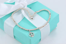Load image into Gallery viewer, Tiffany &amp; Co. Silver Peace Charm Mini Beaded Bracelet
