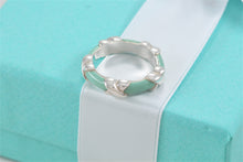 Load image into Gallery viewer, Tiffany &amp; Co. Silver Signature &#39;&#39;X&#39;&#39; Blue Enamel Band Ring
