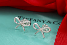Load image into Gallery viewer, Tiffany &amp; Co. Silver Ribbon Bow Stud Earrings
