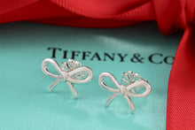 Load image into Gallery viewer, Tiffany &amp; Co. Silver Ribbon Bow Stud Earrings
