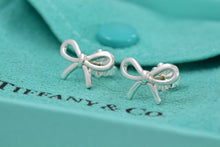 Load image into Gallery viewer, Tiffany &amp; Co. Silver Ribbon Bow Stud Earrings
