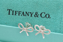 Load image into Gallery viewer, Tiffany &amp; Co. Silver Ribbon Bow Stud Earrings
