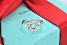 Load image into Gallery viewer, Tiffany &amp; Co. Atlas Silver Roman Numeral Medallion Ring Size 5.5
