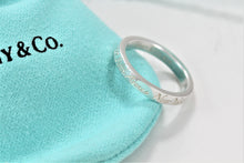 Load image into Gallery viewer, Tiffany &amp; Co. Silver Notes &quot;Fifth Ave&quot; Narrow Band Ring
