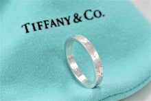 Load image into Gallery viewer, Tiffany &amp; Co. Silver Notes &quot;Fifth Ave&quot; Narrow Band Ring
