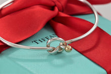 Load image into Gallery viewer, Tiffany &amp; Co. 18K Gold &amp; Silver Love Knot Hook Bangle Bracelet
