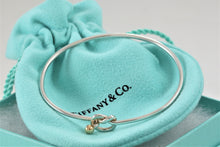 Load image into Gallery viewer, Tiffany &amp; Co. 18K Gold &amp; Silver Love Knot Hook Bangle Bracelet
