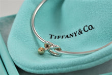 Load image into Gallery viewer, Tiffany &amp; Co. 18K Gold &amp; Silver Love Knot Hook Bangle Bracelet
