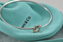 Load image into Gallery viewer, Tiffany &amp; Co. 18K Gold &amp; Silver Love Knot Hook Bangle Bracelet
