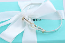 Load image into Gallery viewer, Tiffany &amp; Co. 18K Gold &amp; Silver Double Circle Hook Bangle Bracelet
