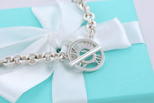 Load image into Gallery viewer, Tiffany &amp; Co. Atlas Silver Roman Numerals Medallion Toggle Necklace
