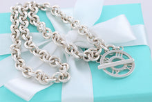 Load image into Gallery viewer, Tiffany &amp; Co. Atlas Silver Roman Numerals Medallion Toggle Necklace
