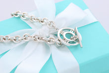 Load image into Gallery viewer, Tiffany &amp; Co. Atlas Silver Roman Numerals Medallion Toggle Necklace
