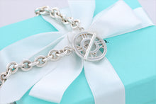 Load image into Gallery viewer, Tiffany &amp; Co. Atlas Silver Roman Numerals Medallion Toggle Necklace
