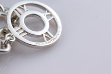 Load image into Gallery viewer, Tiffany &amp; Co. Atlas Silver Roman Numerals Medallion Toggle Necklace
