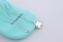 Load image into Gallery viewer, Tiffany &amp; Co. Silver Twist Clover Charm Pendant Necklace
