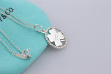 Load image into Gallery viewer, Tiffany &amp; Co. Silver Twist Clover Charm Pendant Necklace
