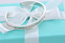 Load image into Gallery viewer, Tiffany &amp; Co. Atlas Silver Roman Numeral Narrow Cuff Bracelet
