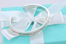 Load image into Gallery viewer, Tiffany &amp; Co. Atlas Silver Roman Numeral Narrow Cuff Bracelet
