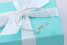 Load image into Gallery viewer, Tiffany &amp; Co. 14K Gold Trim &amp; Silver Double Heart Hook Bangle Bracelet

