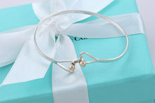 Load image into Gallery viewer, Tiffany &amp; Co. 14K Gold Trim &amp; Silver Double Heart Hook Bangle Bracelet
