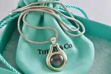 Load image into Gallery viewer, Tiffany &amp; Co. 18K Gold Hematite Round Pendant Snake Chain Necklace
