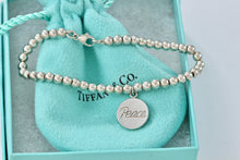 Load image into Gallery viewer, Tiffany &amp; co. Paloma Picasso Silver Grafitti &quot;PEACE&quot; Circle Disc Bead Bracelet
