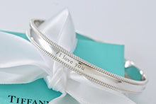 Load image into Gallery viewer, Tiffany &amp; Co. Silver Yours &quot;I Love You&quot; Beaded Edge Bangle
