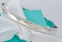 Load image into Gallery viewer, Tiffany &amp; Co. Silver Yours &quot;I Love You&quot; Beaded Edge Bangle
