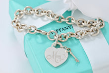 Load image into Gallery viewer, Tiffany &amp; Co. Silver &quot;MOM&quot; inscribed Heart &amp; Mini Key Charm Bracelet
