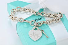 Load image into Gallery viewer, Tiffany &amp; Co. Silver &quot;MOM&quot; inscribed Heart &amp; Mini Key Charm Bracelet
