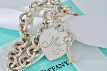Load image into Gallery viewer, Tiffany &amp; Co. Silver &quot;MOM&quot; inscribed Heart &amp; Mini Key Charm Bracelet
