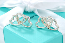 Load image into Gallery viewer, Tiffany &amp; Co. Silver Triple interlocking Heart Clip-On Earrings
