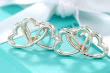 Load image into Gallery viewer, Tiffany &amp; Co. Silver Triple interlocking Heart Clip-On Earrings
