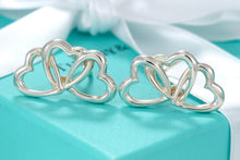 Load image into Gallery viewer, Tiffany &amp; Co. Silver Triple interlocking Heart Clip-On Earrings
