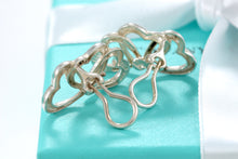 Load image into Gallery viewer, Tiffany &amp; Co. Silver Triple interlocking Heart Clip-On Earrings
