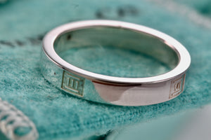 Tiffany & Co. Atlas Silver Motif Narrow Band Ring