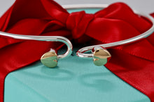 Load image into Gallery viewer, Tiffany 18K Gold &amp; Silver Interlocking Hearts Bangle Bracelet
