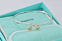 Load image into Gallery viewer, Tiffany 18K Gold &amp; Silver Interlocking Hearts Bangle Bracelet
