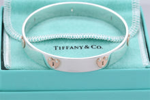 Load image into Gallery viewer, Tiffany &amp; Co. 18K Gold &amp; Silver Keyhole Locks Heart Bangle Bracelet
