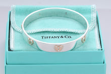 Load image into Gallery viewer, Tiffany &amp; Co. 18K Gold &amp; Silver Keyhole Locks Heart Bangle Bracelet
