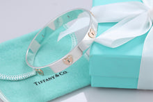Load image into Gallery viewer, Tiffany &amp; Co. 18K Gold &amp; Silver Keyhole Locks Heart Bangle Bracelet
