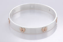Load image into Gallery viewer, Tiffany &amp; Co. 18K Gold &amp; Silver Keyhole Locks Heart Bangle Bracelet
