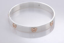 Load image into Gallery viewer, Tiffany &amp; Co. 18K Gold &amp; Silver Keyhole Locks Heart Bangle Bracelet
