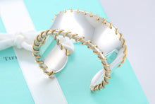 Load image into Gallery viewer, Tiffany &amp; Co. 18Kt. Gold &amp; Silver Spiral Cuff Bracelet
